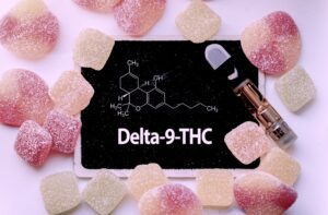 Delta 9 THC is written on a board surrounded by marijuana edibles