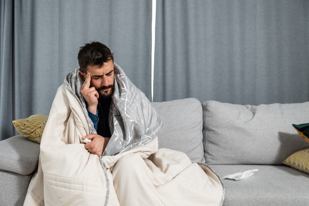 Man with hangover after drinking too much alcohol wondering if hangover patches really work