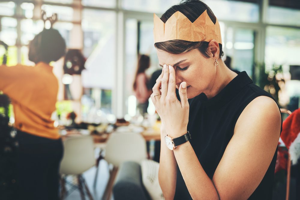 Adult female in a holiday party feeling sad and left out