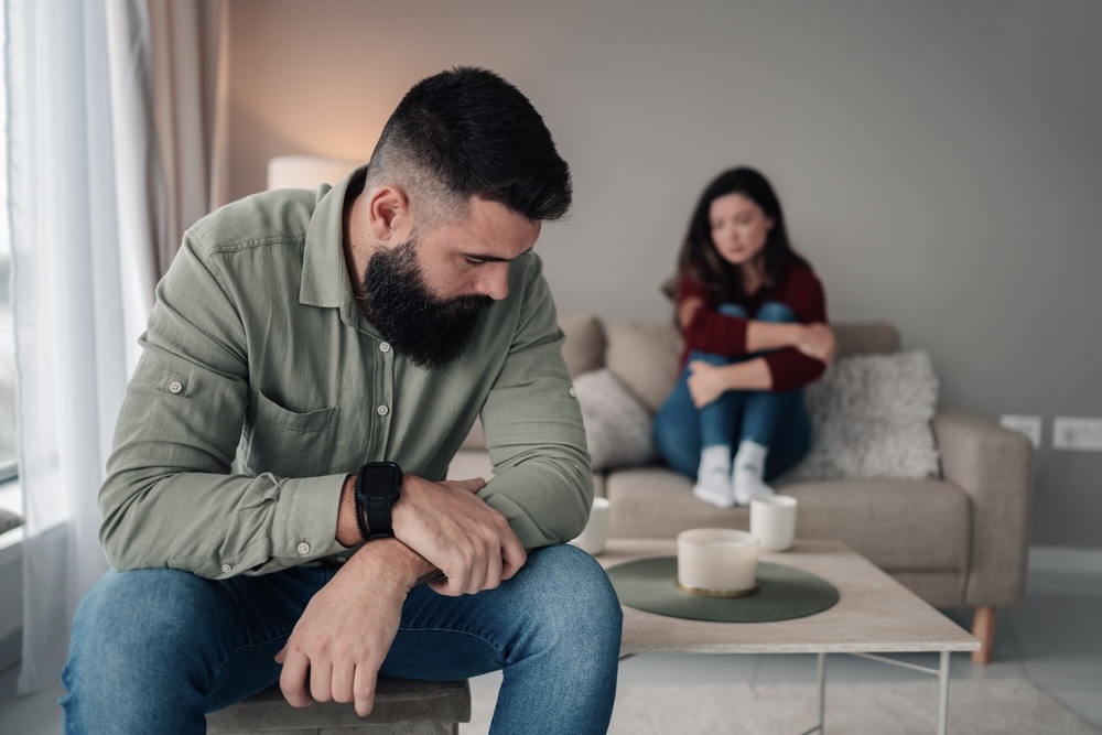 Couple in the living room dating in recovery